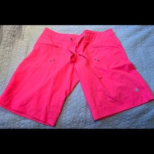 Bright pink board shorts